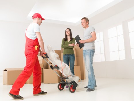 Furniture dismantling and moving through a narrow flat staircase in Cranford